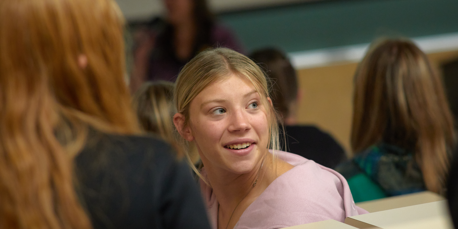 Female student at college assembly