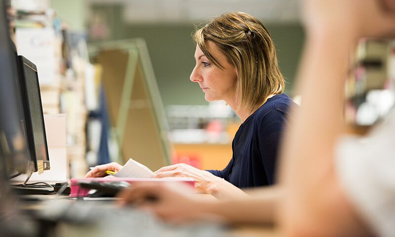 Accounting student working on a computer