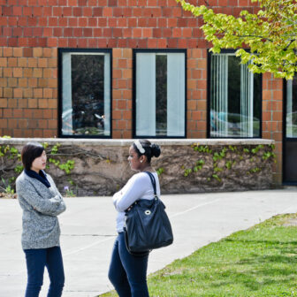 Students talking outside on campus