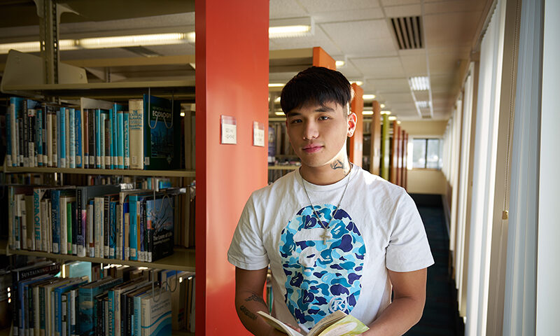 A male student in college library