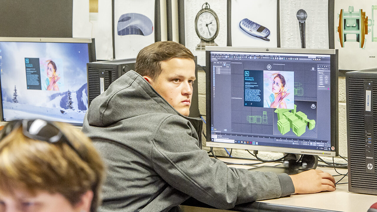 Digital arts student working on a computer