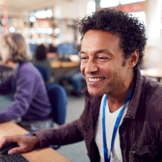 Older student working on a computer
