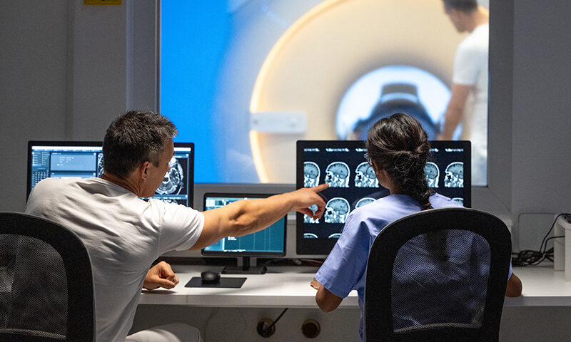 Technicians taking images in MRI