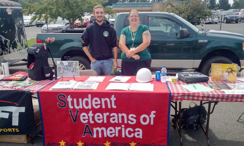 Two students participating in Veterans Club BBQ Event in 2019