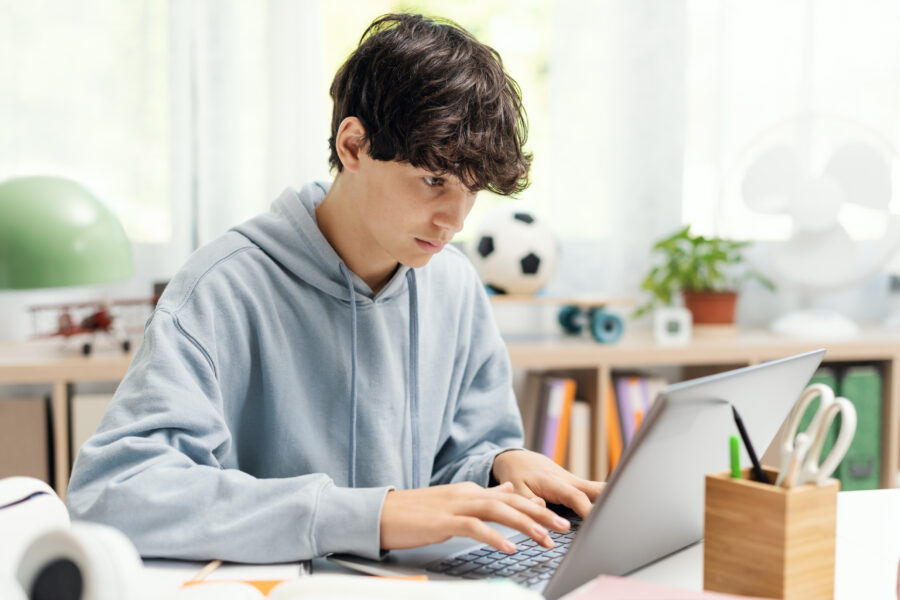 High school student studying at home.