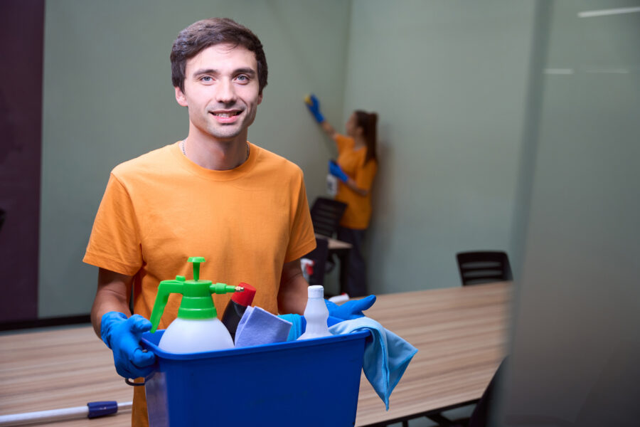 Janitorial staff cleaning an office