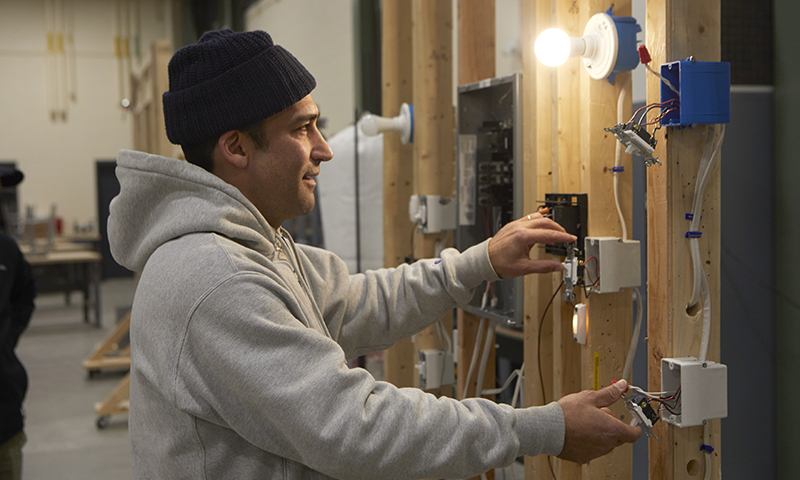 electrician working on a residential panel board